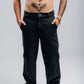 Twist Pants in Black Denim by The Noie Studio